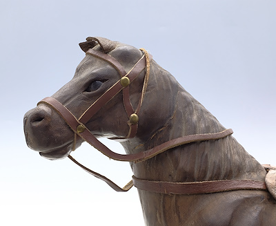 WOOD AND LEATHER HORSE STATUE-Wooden carving with leather covering