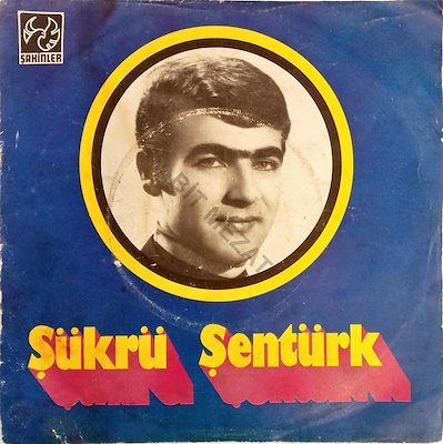 ŞÜKRÜ ŞENTÜRK / BİR SEVENİM OLMADI-K 6 P 6-7 KAPAK ARKA KISIMDA